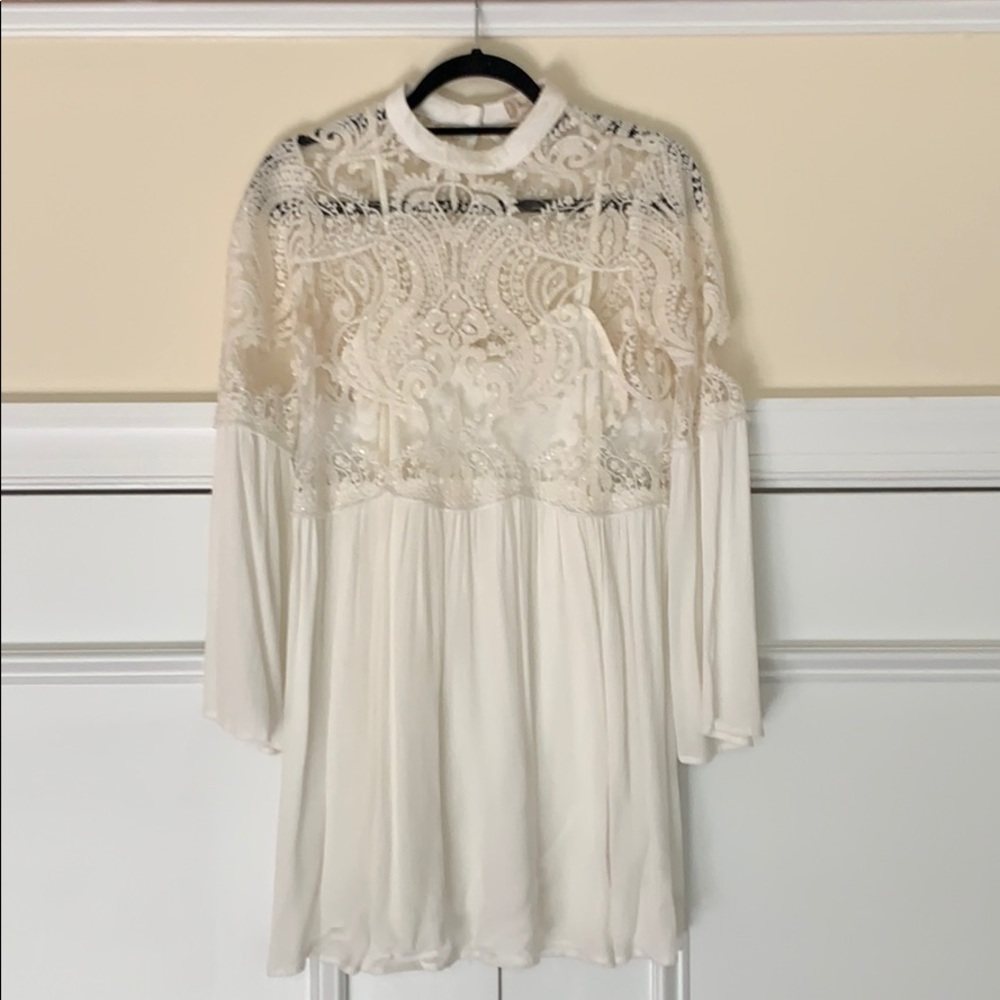 Snow-white sequin baby-doll dress.